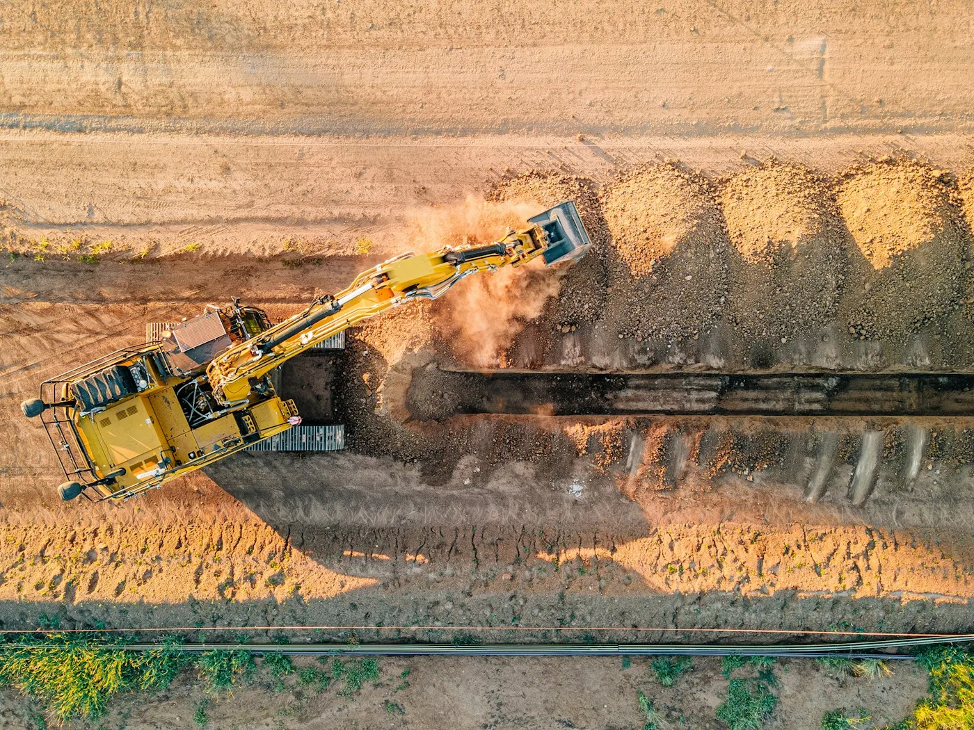 Overhead view of an excavator and cut ground